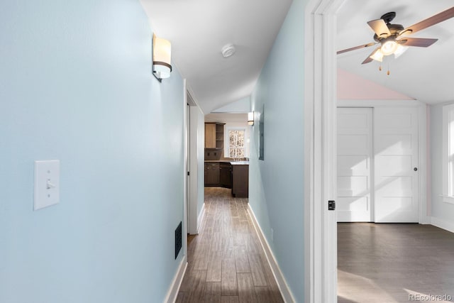 401 Chase St, Black Hawk, CO 80422 - corridor with lofted ceiling, wood finished floors, and baseboards