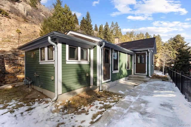 401 Chase St, Black Hawk, CO 80422 - view of front of property featuring a chimney and a patio area