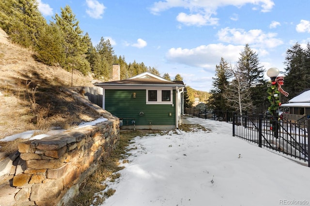 401 Chase St, Black Hawk, CO 80422 - view of snowy exterior with a chimney