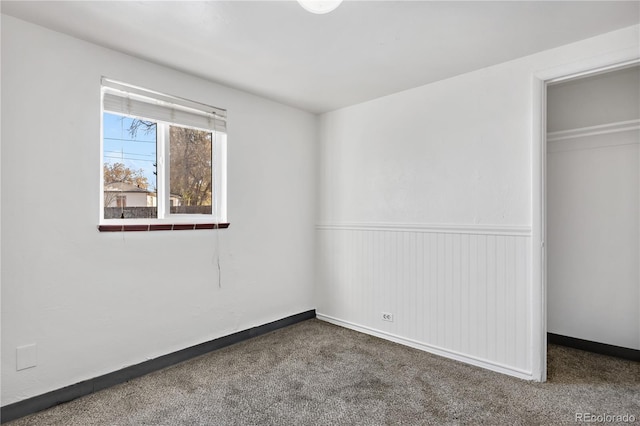 unfurnished bedroom featuring a closet and carpet floors