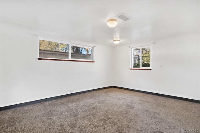 unfurnished room featuring carpet