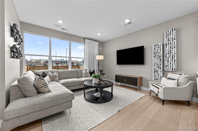 9445 W 58th Cir Unit B, Arvada, CO 80002 - living room featuring light wood-type flooring and recessed lighting