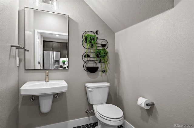 9445 W 58th Cir Unit B, Arvada, CO 80002 - bathroom with lofted ceiling and toilet