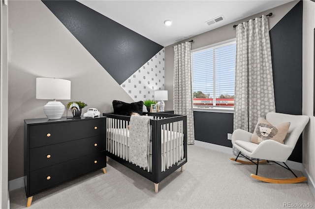 9445 W 58th Cir Unit B, Arvada, CO 80002 - bedroom with carpet floors and a crib