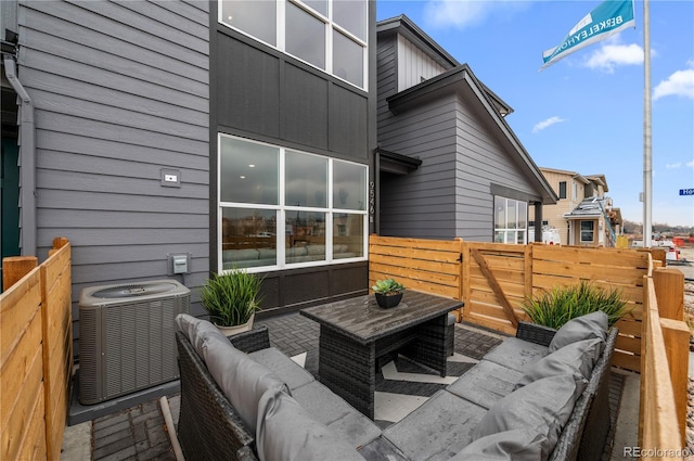9445 W 58th Cir Unit B, Arvada, CO 80002 - wooden terrace featuring an outdoor living space and a patio area