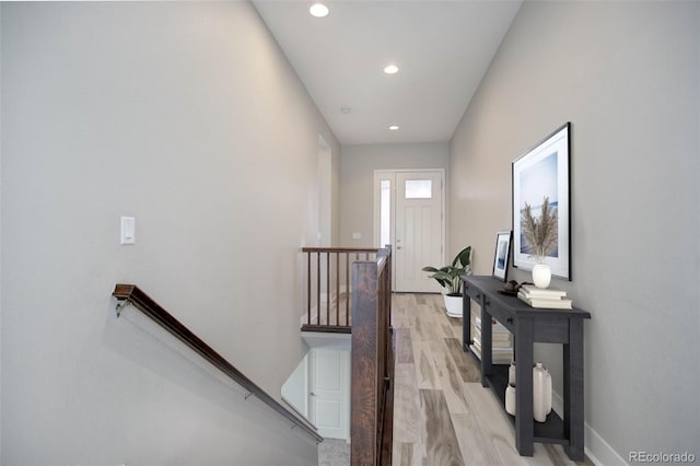 hall with light hardwood / wood-style floors