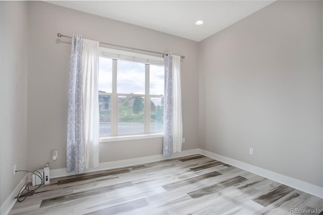 unfurnished room featuring light hardwood / wood-style flooring