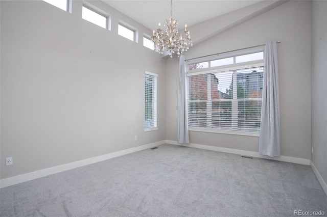 unfurnished room featuring high vaulted ceiling, carpet, and an inviting chandelier