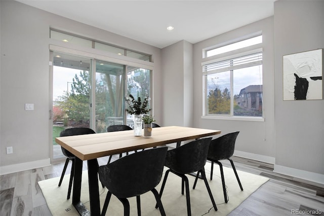 dining area with light wood-type flooring