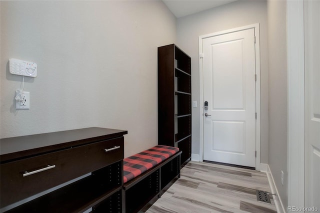 mudroom with light hardwood / wood-style floors