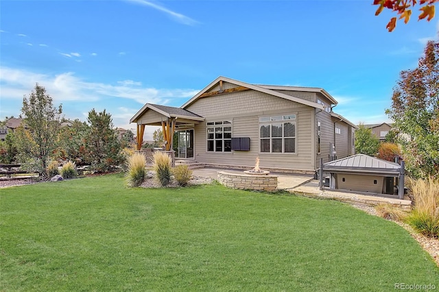 rear view of property featuring a yard and a patio