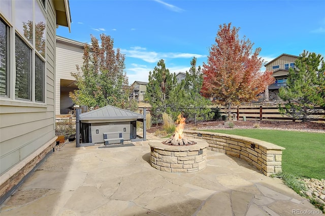 view of patio / terrace featuring a gazebo and a fire pit