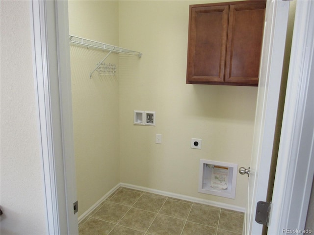 laundry area featuring cabinet space, light tile patterned floors, baseboards, hookup for a washing machine, and electric dryer hookup