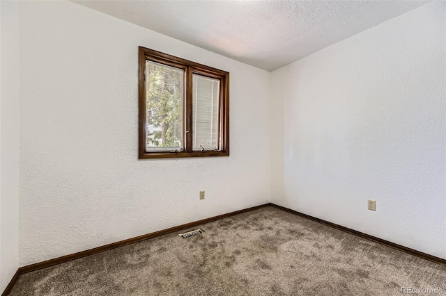 16293 E Brown Pl, Aurora, CO 80013 - carpeted spare room featuring baseboards and a textured wall