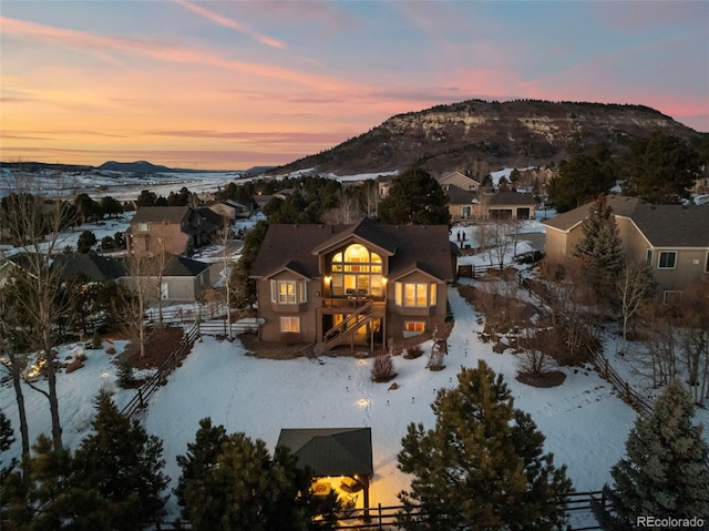 snowy aerial view with a mountain view