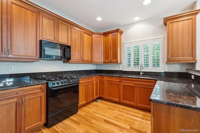 11969 E Lake Cir, Greenwood Village, CO 80111 - kitchen featuring black appliances, a sink, light wood finished floors, brown cabinets, and recessed lighting