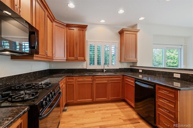 11969 E Lake Cir, Greenwood Village, CO 80111 - kitchen featuring black appliances, a sink, light wood finished floors, dark stone counters, and recessed lighting