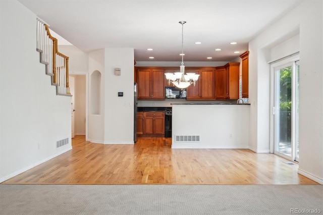 11969 E Lake Cir, Greenwood Village, CO 80111 - kitchen featuring black microwave, dark countertops, a chandelier, light wood finished floors, and recessed lighting