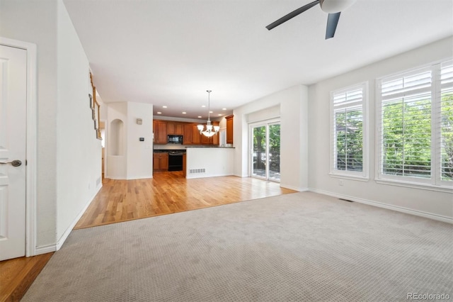 11969 E Lake Cir, Greenwood Village, CO 80111 - unfurnished living room featuring a chandelier, a ceiling fan, light wood-style floors, baseboards, and recessed lighting