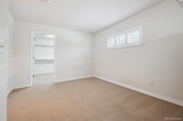 11969 E Lake Cir, Greenwood Village, CO 80111 - empty room featuring carpet floors and baseboards