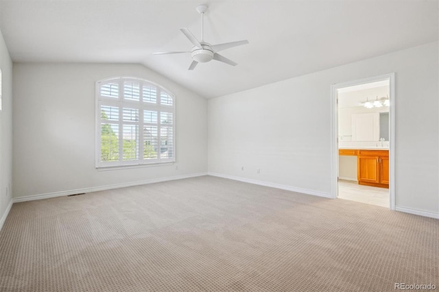 11969 E Lake Cir, Greenwood Village, CO 80111 - empty room with lofted ceiling, a ceiling fan, light colored carpet, baseboards, and a sink