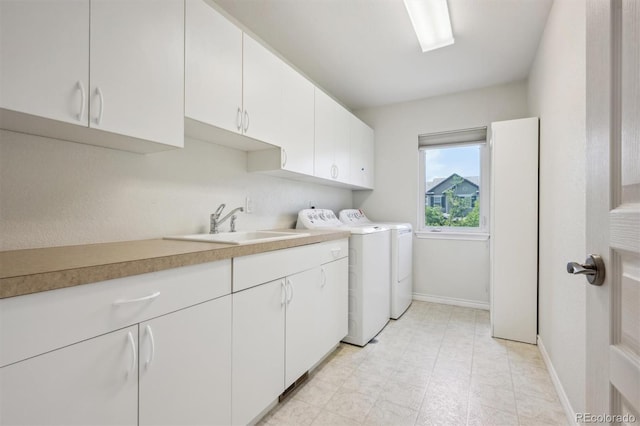 11969 E Lake Cir, Greenwood Village, CO 80111 - laundry room featuring washer and dryer, cabinet space, and baseboards