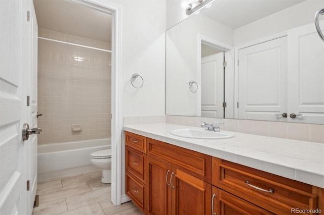 11969 E Lake Cir, Greenwood Village, CO 80111 - full bathroom with toilet, vanity, tile patterned flooring, and washtub / shower combination