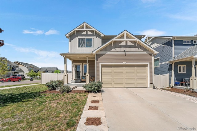 4405 Walden Ct, Denver, CO 80249 - view of front of property featuring board and batten siding, covered porch, driveway, and a garage