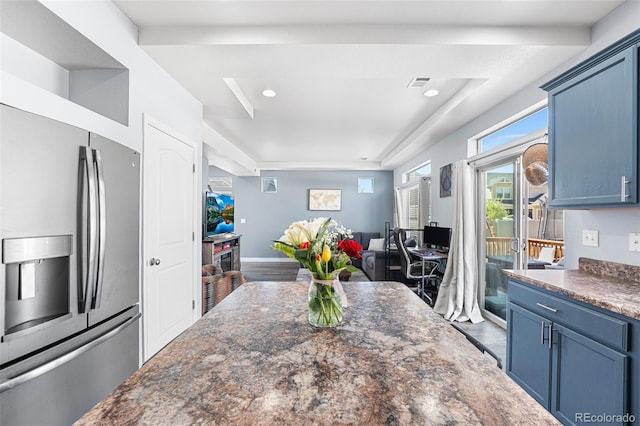 4405 Walden Ct, Denver, CO 80249 - kitchen with stainless steel refrigerator with ice dispenser, blue cabinetry, a raised ceiling, open floor plan, and wood finished floors