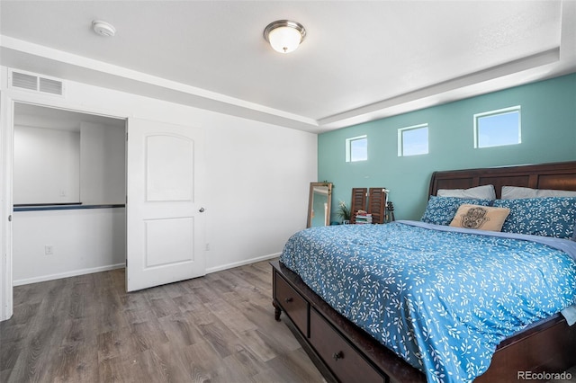 4405 Walden Ct, Denver, CO 80249 - bedroom with wood finished floors and baseboards