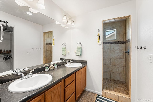 4405 Walden Ct, Denver, CO 80249 - full bathroom featuring a tile shower, double vanity, and tile patterned floors