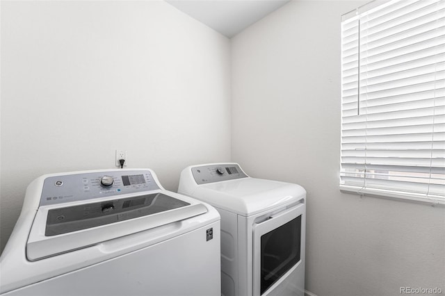 4405 Walden Ct, Denver, CO 80249 - clothes washing area with washer and clothes dryer