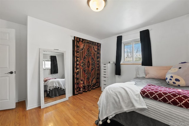 bedroom featuring light wood-style floors