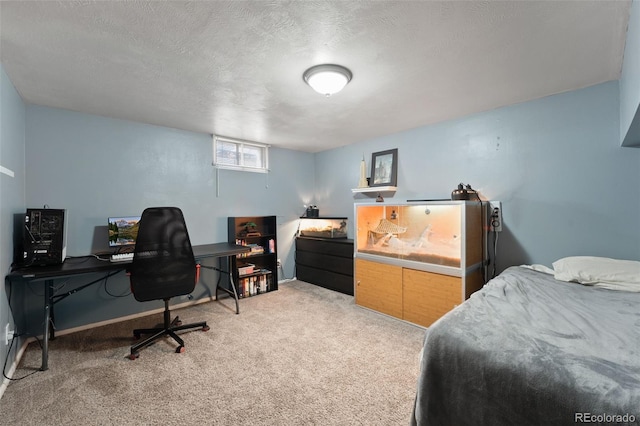 carpeted bedroom with baseboards and a textured ceiling