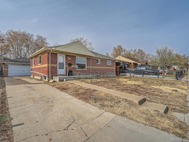 ranch-style home with a garage and an outbuilding