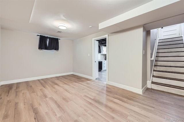 basement featuring light hardwood / wood-style flooring