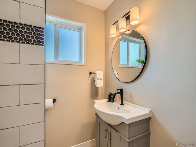 bathroom with a healthy amount of sunlight and vanity