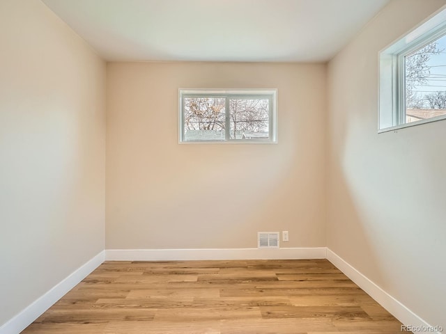 spare room with light wood-type flooring