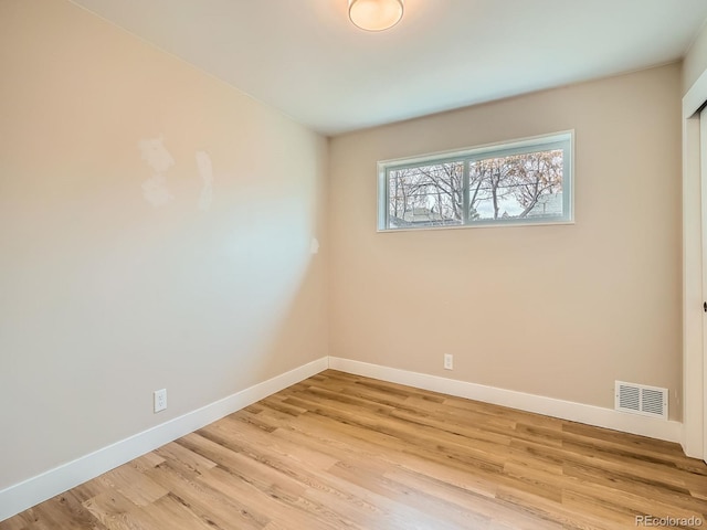 unfurnished room featuring light hardwood / wood-style flooring