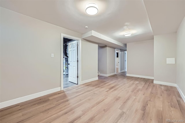 empty room with light hardwood / wood-style flooring