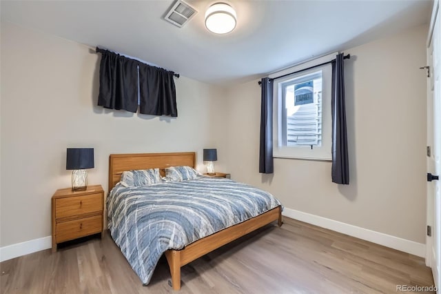 bedroom featuring hardwood / wood-style flooring