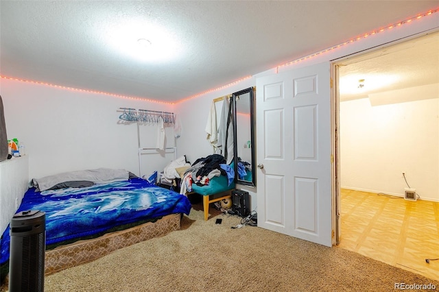 612 W Bijou Ave, Fort Morgan, CO 80701 - bedroom featuring carpet and a textured ceiling