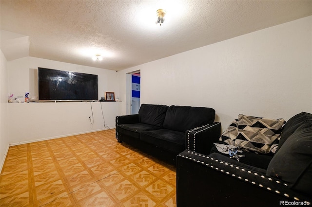 612 W Bijou Ave, Fort Morgan, CO 80701 - living area featuring a textured ceiling