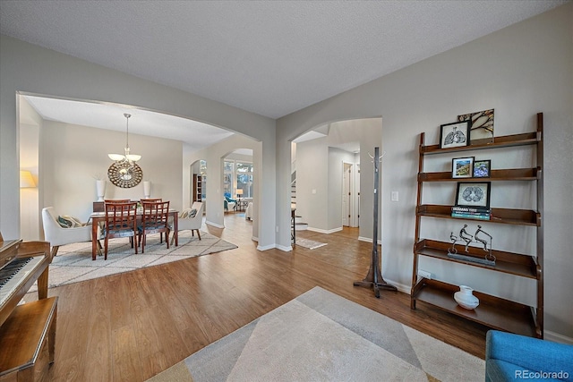 interior space featuring a textured ceiling and light wood-type flooring