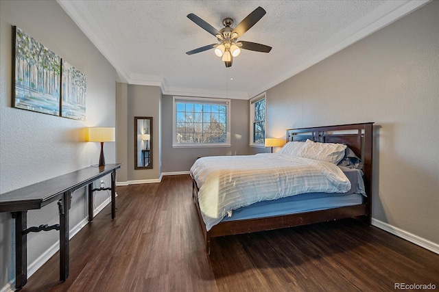 bedroom featuring ceiling fan, dark wood-type flooring, crown molding, and a textured ceiling