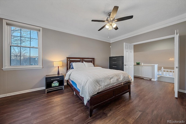 bedroom with ceiling fan, dark wood-type flooring, ornamental molding, and a textured ceiling