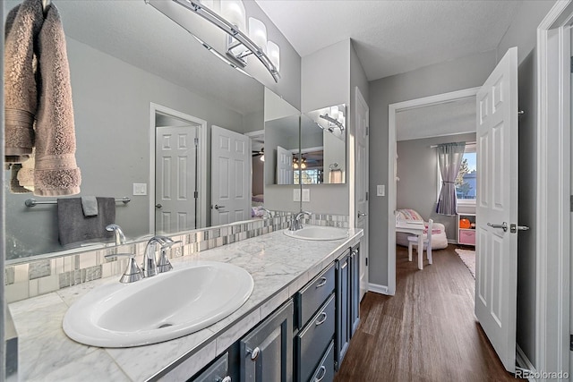 bathroom with vanity and wood-type flooring