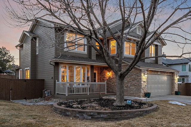 view of front of property with a garage and covered porch