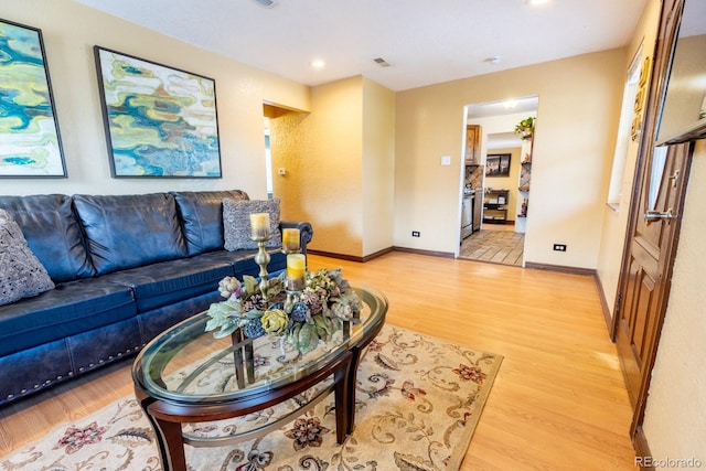 3021 Grape St, Denver, CO 80207 - living area with light wood-style flooring, baseboards, and recessed lighting