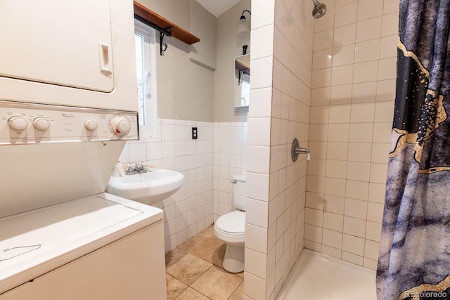 3021 Grape St, Denver, CO 80207 - full bath with stacked washing machine and dryer, a sink, a shower stall, toilet, and tile walls